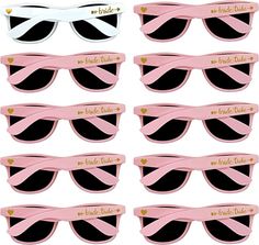 six pairs of pink and black sunglasses with gold hearts on the side, each pair has two