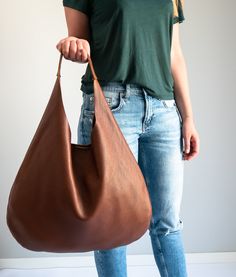 LEATHER SHOULDER BAG is made of 100% high quality natural leather. Very practical for carrying on the shoulder. The purse closes with a magnetic closure. Inside there is one zippered pocket. To be worn on the shoulder or in the hand. Accommodates A4 format (US Lettel format). Spacious interior provides room for all the daily essentials. This bag is perfect as your everyday bag, which can fit an IPAD, A4 files (US Lettel files), books, magazines, cosmetic bag as well as many accessories. Main fea Cognac Soft Leather Hobo Bag For Everyday, Cognac Hobo Bag With Smooth Grain For Everyday, Soft Leather Saddle Bag For Everyday Use, Cognac Saddle Shoulder Bag For Daily Use, Cognac Soft Leather Hobo Bag For Errands, Everyday Cognac Hobo Bag With Leather Lining, Everyday Cognac Hobo Shoulder Bag, Brown Leather-lined Hobo Bag For Everyday, Cognac Leather Hobo Bag For Everyday Use