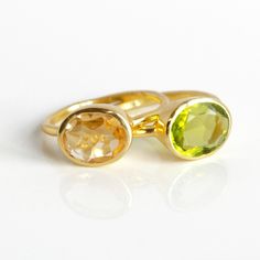 You'll love this pairing of TWO oval gemstones rings: Peridot Quartz and Citrine Quartz. The yellow green and champaign yellow gemstones make for a beautiful combination. Both stones are flawless and transparent. Available in bright sterling silver or 18k vermeil gold.Gemstone are approximately 8mm x 13mm in size.Open back setting.Band stamped with 925 on inside.METAL 18K VERMEIL GOLD 18K VERMEIL ROSE GOLD BRIGHT STERLING SILVER Ring will be shipped in Danique Jewelry gift box.💍CREATE YOUR OWN Gemstones Rings, Yellow Gemstones, Oval Rings, Jewelry Gift Box, Jewelry Gift, Citrine, Silver Ring, Sterling Silver Rings, Gemstone Rings