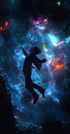 a man flying through the air in front of a colorful sky filled with stars and clouds