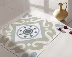 a vase sitting on top of a white tiled floor