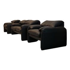 a set of three black leather couches