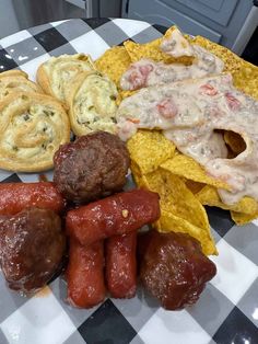 an assortment of food items on a checkered plate