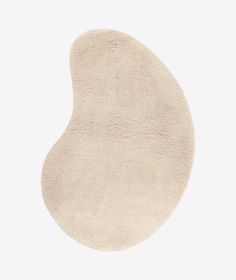 an oval shaped rug on a white background with no one in it or someone else