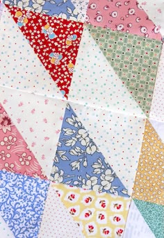 a close up view of a colorful patchwork quilt