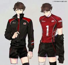 two men in soccer uniforms standing side by side, one wearing black and the other red