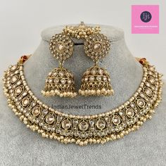 White Antique Polki Kundan necklace set/Reverse Ad Necklace/Statement necklace/Indian/Punjabi Necklace/Pakistani Jewelry/Bridal necklace/ Antique Reverse Ad Stone Necklace With Mehndi Plating Regular Size And Adjustable Stone Necklace Antique Necklace Set with dull gold finish  This is 100% Handmade jewelry. So Color, shades, texture displayed may slightly vary from the actual product due to digital image limitations. We request you to consider these minor variations. Please expect the possibility of some slight imperfections when buying hand made jewelry. If you have any questions, please message or email us. Arrives in gift box. Please let me know if you have any questions. Thank you so much visiting my shop. Wedding Necklaces With Latkans For Eid, Round Kundan Necklace With Tilla For Eid, Heavy Round Bollywood Necklaces, Heavy Round Bollywood Style Necklace, Heavy Kundan Necklace For Ceremonial Occasions During Eid, Heavy Chandbali Necklaces For Eid, Heavy Chandbali Bridal Necklace For Eid, Heavy Necklace For Eid Celebration, Heavy Temple Jewelry Necklaces For Eid