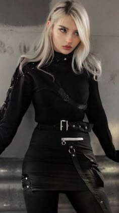 a woman with blonde hair and black clothes