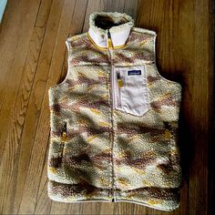 Nwt Patagonia Women’s Classic Retro X Vest. Cool Pattern With Awesome Neutral Colors With A Pop Of Yellow. Super Warm Layer With Wind Resistance Great High Collar To Keep You Toasty. Definitely A Performer Not To Mention A Fun Funky Addition To Your Outerwear Game Casual Mustard Outerwear For Outdoor, Casual Yellow Outerwear For Outdoor Activities, Patagonia Nano Puff Vest, Patagonia Fleece Vest, Patagonia Retro X, Patagonia Vest, Patagonia Down Sweater, Patagonia Nano Puff, Patagonia Fleece