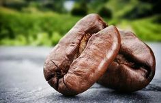 two coffee beans sitting on top of a road next to the words, coffee fact