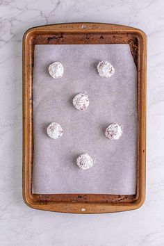 doughnuts on a baking sheet ready to be baked