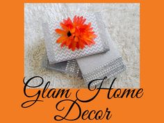 an orange flower sitting on top of a white rug with the words glam home decor