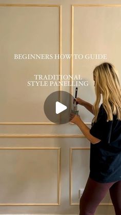 a woman standing in front of a white wall with the words, beginners how to guide traditional style painting