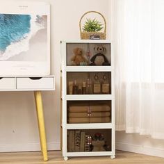 a white book shelf with books on it next to a window