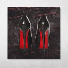 a pair of black and red high heeled shoes on a grungy background