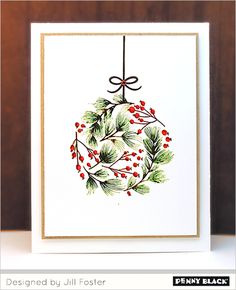 a christmas ornament card with holly and berries on it, designed by jenny black