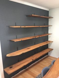 a room with some wooden shelves on the wall