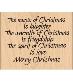 a wooden plaque that says the music of christmas is laughter, the warmth of christmas is friend