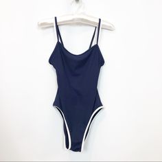 Gorgeous Navy Ribbed One Piece Bathing Suit . Figure Flattering Multi Cup Fit . Slimming Design. White Bra Attached To Suit . Dual Spaghetti Straps . Simple, Clean And Sophisticated Aesthetic. Bust : 16.5” Across In Stretched Excellent Condition. New Without Tags Casual Ribbed Swimwear For Swimming, Casual Solid Ribbed Swimwear, Casual Solid Color Ribbed Swimwear, Casual Navy Swimwear For Spring, Casual Ribbed Swimwear, Casual Fitted Ribbed Swimwear, White Bra, Sophisticated Aesthetic, White Bras