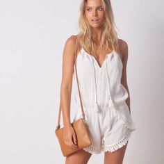 Brand New With Tags!! Rip Curl Sea Dive Romper Jumper In Vanilla. Ivory. Size Large. Adorable - Simple Yet Stylish. Comfortable 100% Cotton And Lightweight. Perfect For Summer. Smocked Off Shoulder Neckline. Elastic Waist. Petal Hem With Tassel Trim. Embroidery Detailing On Front. Slip On Design. Spaghetti Straps. Machine Washable. Smoke Free Home. All My Items Are Guaranteed Authentic. White Casual Swimwear For Summer Outings, White Casual Swimwear For Day Out, Jumper Shorts, Spring Beach Bloomers, Short, Forever 21 Beach Shorts With Built-in Shorts, Rip Curl, Embroidery Details, Smocking, Elastic Waist