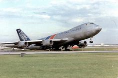 an airplane that is sitting on the tarmac with it's landing gear down