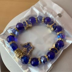 Brand New In Sealed Package Blue Beaded Bracelet With Butterfly Charm Blue Adjustable Charm Bracelet For Party, Adjustable Blue Charm Bracelet For Party, Adjustable Blue Charm Bracelet For Parties, Casual Blue Beaded Stretch Bracelet, Blue Charm Bracelet For Party, Blue Beads For Jewelry Making, Casual Blue Beaded Jewelry, Casual Blue Beaded Bracelet With Faceted Beads, Casual Blue Faceted Beads Bracelet