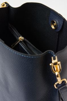 Description
 Bucket bag in navy blue grained leather. It has a removable strap with gold details. The interior has a zippered compartment and a gold button to close the bag. Made in Italy.
 Composition
 100% Leather
 Measures
 Height 27 cm
 Diameter 23 cm Fragrance Gift, Short Shirts, Gold Buttons, Gold Details, Ring Bracelet, Skirt Pants, Handbag Accessories, Earring Necklace, Sweater Jacket