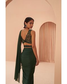 Indian Green Saree - Parul Gandhi Exuding stunning elegance, this pre-draped saree features a sleek design, adorned with tonal leaf motif embroidery on the blouse and belt. The intricate detailing adds a touch of sophistication, creating a seamless blend of modern style and traditional charm. Step into grace and glamour with this sleek pre-draped saree ensemble, where every element contributes to its breathtaking allure. Included in Purchase: Saree & Blouse Product Specification Color: Bottle Gr Elegant Saree Sets With Draped Sleeves, Elegant Floor-length Pre-draped Saree With Unstitched Blouse, Elegant Designer Choli With Draped Sleeves, Elegant Side Open Georgette Choli, Elegant Draped Designer Wear Choli, Elegant Draped Choli For Designer Wear, Elegant Draped Designer Choli, Elegant Unstitched Side Open Choli, Elegant Unstitched Side-open Choli