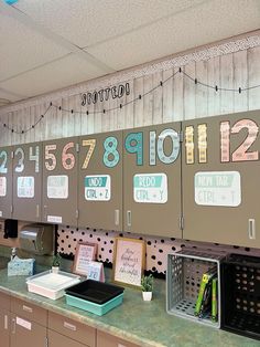 an office cubicle with lots of magnets and numbers on the wall above it