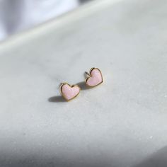 Micro Heart Stud Earrings 24k Gold Plated Heart Frame around a Marble Pink Enamel Heart Stainless Steel Earring Post - Okay for most ears, would not recommend for highly sensitive individuals 7mm Micro Size Stud Earrings Pink Gold Heart Earrings For Gift, Pink Gold Jewelry For Valentine's Day, Gold Tiny Heart Earrings For Valentine's Day, Dainty Pink Gold Earrings Gift, Valentine's Day Tiny Gold Heart Earrings, Hypoallergenic Pink Gold Earrings Gift, Tiny Gold Heart Earrings For Gifts, Tiny Heart-shaped Gold Earrings, Tiny Rose Gold Heart Earrings