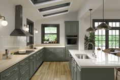 a large kitchen with green cabinets and white counter tops, along with wooden flooring