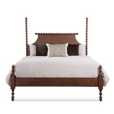 a bed with four posts and pillows on it's headboard, sitting against a white background