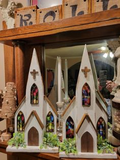 a wooden cabinet with stained glass windows in it