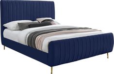 a bed with blue velvet upholstered headboard and foot board is shown in front of a white background