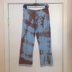 This Is A Brand New Love Tanjane Pair Of Pajama Bottoms. Blue And Brown Tie Dye With Blue Lace Trim. Draw String Waist. Made Of A Soft And Stretchy Material. Measures 17 Inches Across The Waist And Is About 26 Inches In Inseam Length. Made In Southern California And Hand Dyed. Price Is Firm. Thanks For Looking. Casual Cotton Pants With Lace Trim, Stretch Lounge Pants With Lace Trim, Casual Blue Sleepwear With Lace Trim, Stretch Pants With Lace Trim For Loungewear, Cotton Lace Trim Pajama Bottoms, Stretch Lace Trim Pants For Loungewear, Relaxed Fit Lace Trim Sleepwear For Loungewear, Cotton Lace Trim Bottoms For Pajama Party, Casual Blue Lace-trim Sleepwear