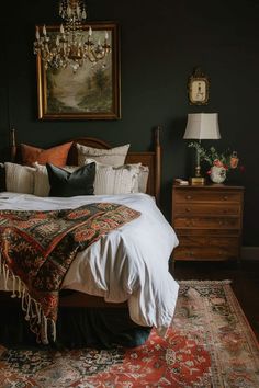 a bedroom with a bed, rugs and paintings on the wall above it's headboard