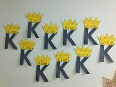 several pieces of paper cut out to look like crowns with the words king and queen on them