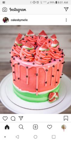 a cake with pink frosting and watermelon icing on top is shown