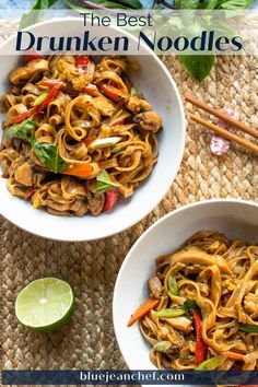 two bowls filled with noodles and vegetables on top of a mat next to chopsticks