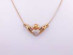 Vintage 9ct Yellow Gold and Diamond Necklace Heart Claddagh Design 16 Inch Chain 4.5g Here we have a beautiful vintage 9ct yellow gold Claddagh necklace, in the middle of which is a small heart encrusted with 11 small diamonds. Comes with the original 16 inch 9ct yellow gold rope type chain with a spring ring clasp. Hallmarks present.   In excellent condition overall, the diamonds sparkle very nicely in the light and it is a simple, elegant and timeless piece that sits around the clavicle area. Gold And Diamond Necklace, Claddagh Necklace, Mystic Quartz, Velvet Ring Box, Heart Necklace Diamond, Necklace Heart, Vintage Heart, Quartz Ring, Simple Elegant