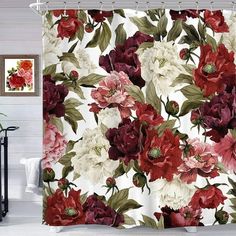 a shower curtain with red and white flowers on it