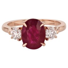 An exquisite heirloom, this handcrafted 18kt. rose gold ring features a dazzling 3.05ct Burma ruby with round diamonds on each side. The perfect symbol of commitment, it's certified by GIA and part of the H&H Collection. Size 6.75. Burma Ruby and Round Diamond Rose Gold Ring 18kt. Rose Gold 3.05ct Burma Ruby GIA Certificate #5172138214 0.56ct TW round Diamond E/F VS on each side Handmade prong set ring Size 6.75 H&H Collection SKU: 23066 Gia Certificate, Cocktail Rings, Round Diamond, Rose Gold Ring, Prong Setting, Or Rose, Gold Ring, Round Diamonds, Gold Rings