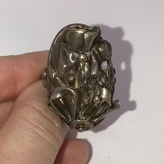 This Is A Rather Large And Heavy Vintage Ring Shaped Like A Bouquet Of Flowers With A Tulip At The Top. This Is Solid Sterling Silver. The Ring Is A Size 7 1/2. This Ring Measures 2.76mm At The Bottom And 4.72mm Wide At The Top Where The Design In. This Ring Weighs 10.78 Grams. This Ring Is Sterling Silver. The Ring Design Itself Measures 30.97mm By 21.33mm. This Ring Is Hallmarked As Sterling. This Ring Is Quite Tarnished And I Can Hand Polish It Before Shipment Upon Request. Vintage Silver Flower Ring For Formal Occasions, Silver Metal Flower Ring For Anniversary, Silver Metal Flower Ring For Wedding, Pear Wedding Ring, Raw Diamond Engagement Rings, Silver Wrap Ring, Silver Flower Ring, Moon And Star Ring, Moonstone Ring Sterling Silver