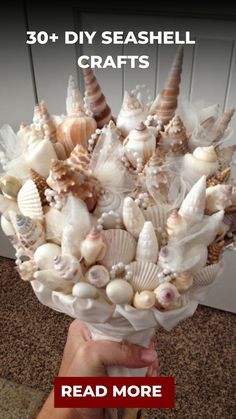 someone holding a bouquet of seashells in their hand with the caption reads, 30 diy seashell crafts read more