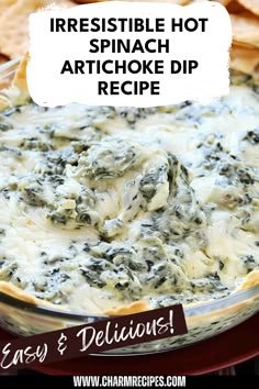 spinach artichoke dip in a glass bowl with crackers