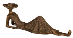 a bronze statue is laying down with a hat on its head