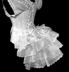 "Too cute to be covered, our ruffled Rustle Bustle makes for a great addition to any costume. Wear on the outside for a cute ruffle-y flare or under your skirt for a traditional Victorian bustled back. Ready to ship in layers of white eyelet lace. Our \"Rustle\" or ruffle bustle is a modest sized bustle with light steel boning, and three fluffy ruffles adding to the fullness. They work well as outerwear or underwear. This listing includes one Rustle, to be worn at the back as a bustle. Your Rust White Nurse Dress, Baroque Costume, Masquerade Costumes, Historical Period, Victorian Clothing, Period Costumes, Nursing Dress, Costume Cosplay, White Eyelet