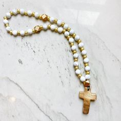 Beautiful prayer beads are made with 30 15mm silicone beads separated by shimmering gold beads. Handmade gold crosses adorn prayer beads. Perfect gift for weddings, baptisms, housewarming gift, and teacher presents! Color options are endless! Don’t see the color you are looking for? Message us! We can order it for you. *Please Note* We do our best to represent our prayer beads as accurately as possible. Colors may vary slightly between your computer and the final product you receive. Send us a m Gold Spiritual Rosary For Meditation, Gold Necklaces With 8mm Beads For Blessing, Gold Rosary With 8mm Beads For Meditation, Spiritual Rosary With Large Beads As Gift, White Wooden Beads Rosary As Gift, White Rosary With Wooden Beads As Gift, Gold Rosary For Meditation, Phone Attachment, Teacher Presents