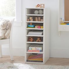 a white book shelf filled with lots of books