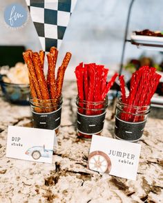 three jars filled with different types of food on top of a table next to each other